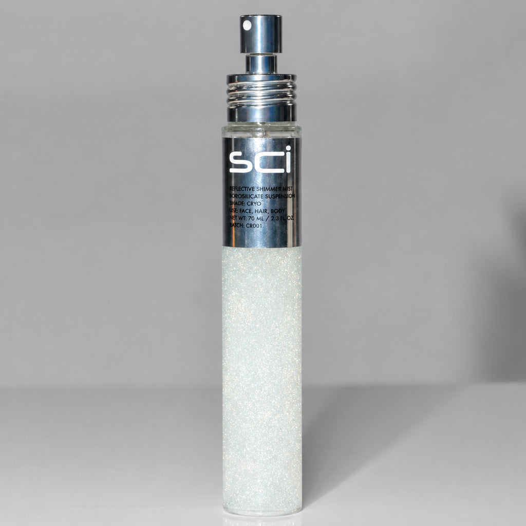 A cylindrical cosmetic bottle filled with sparkling white powder or glitter, featuring a metallic silver pump and a silver label with the brand name 'sci'.