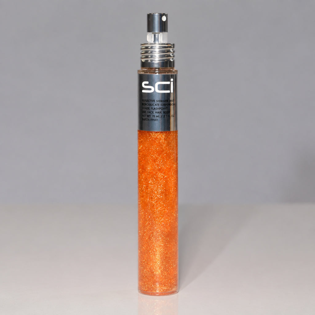 SCI Smooth Glittery Hair Spray in a clear cylindrical bottle filled with shimmering orange glitter, featuring a black and silver spray nozzle, set against a neutral gray background.
